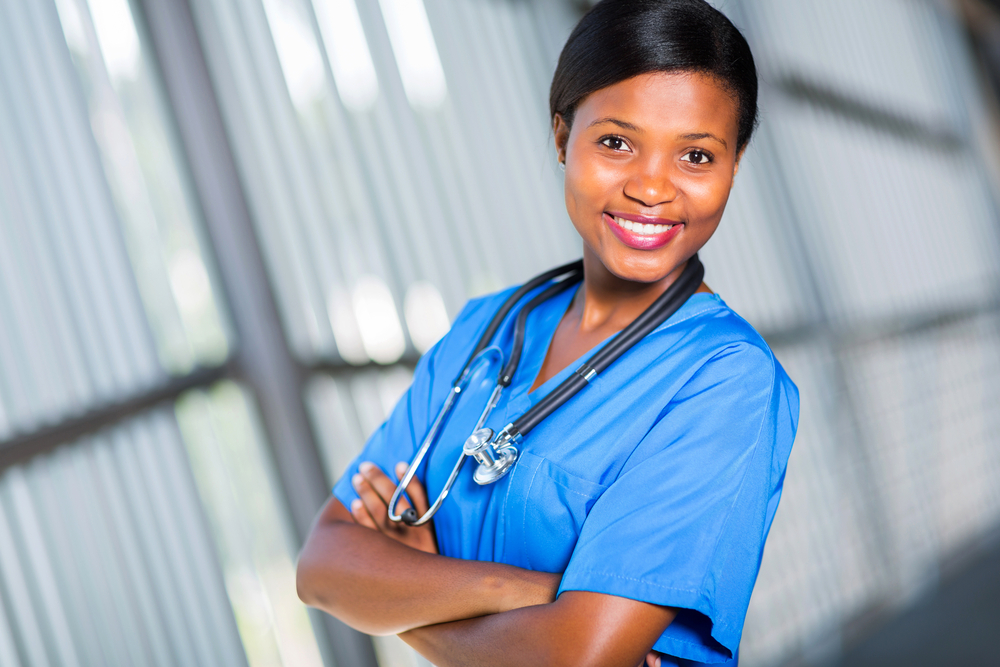 Young female medical assistant smiling in her uniform