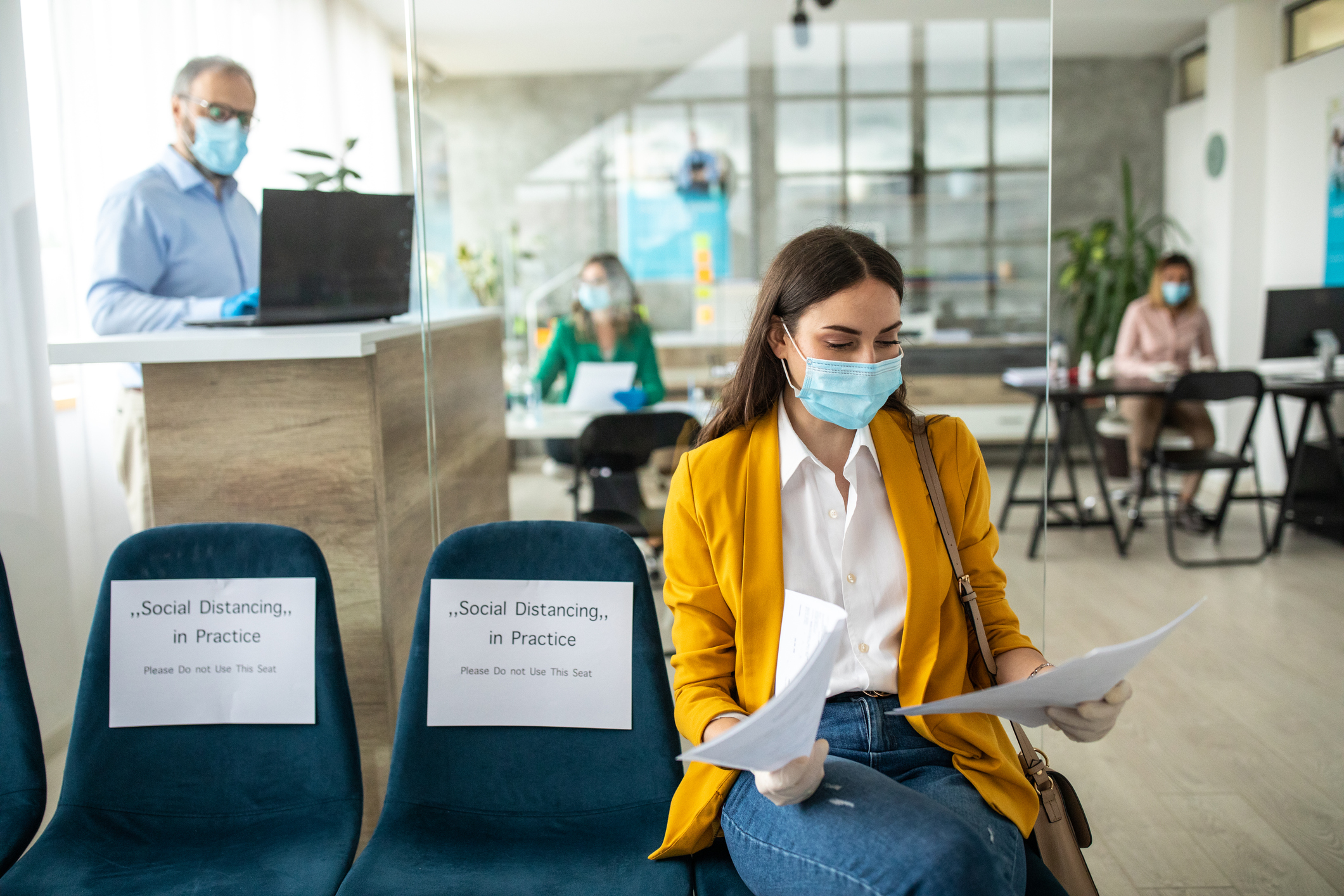 Female Patient wearing a yellow shirt waiting in a medical office