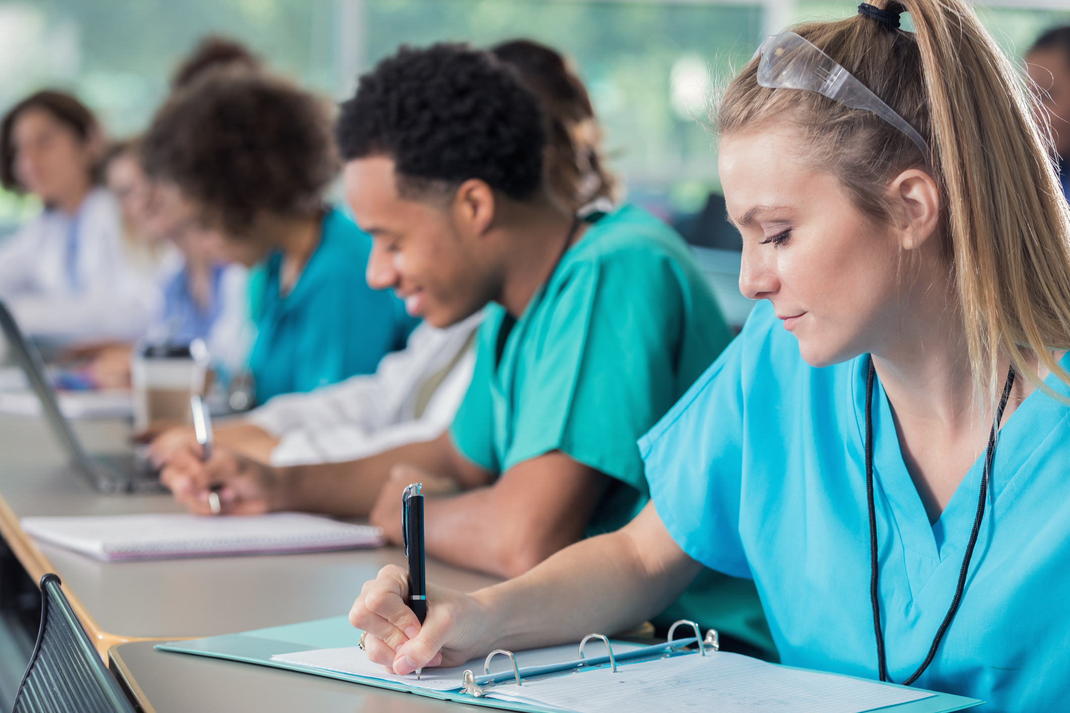 Medical Assistant students taking notes in a classroom