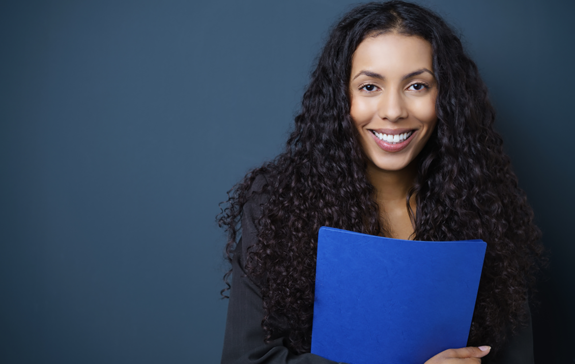 Young female student ready for an interview holding a folder a folder