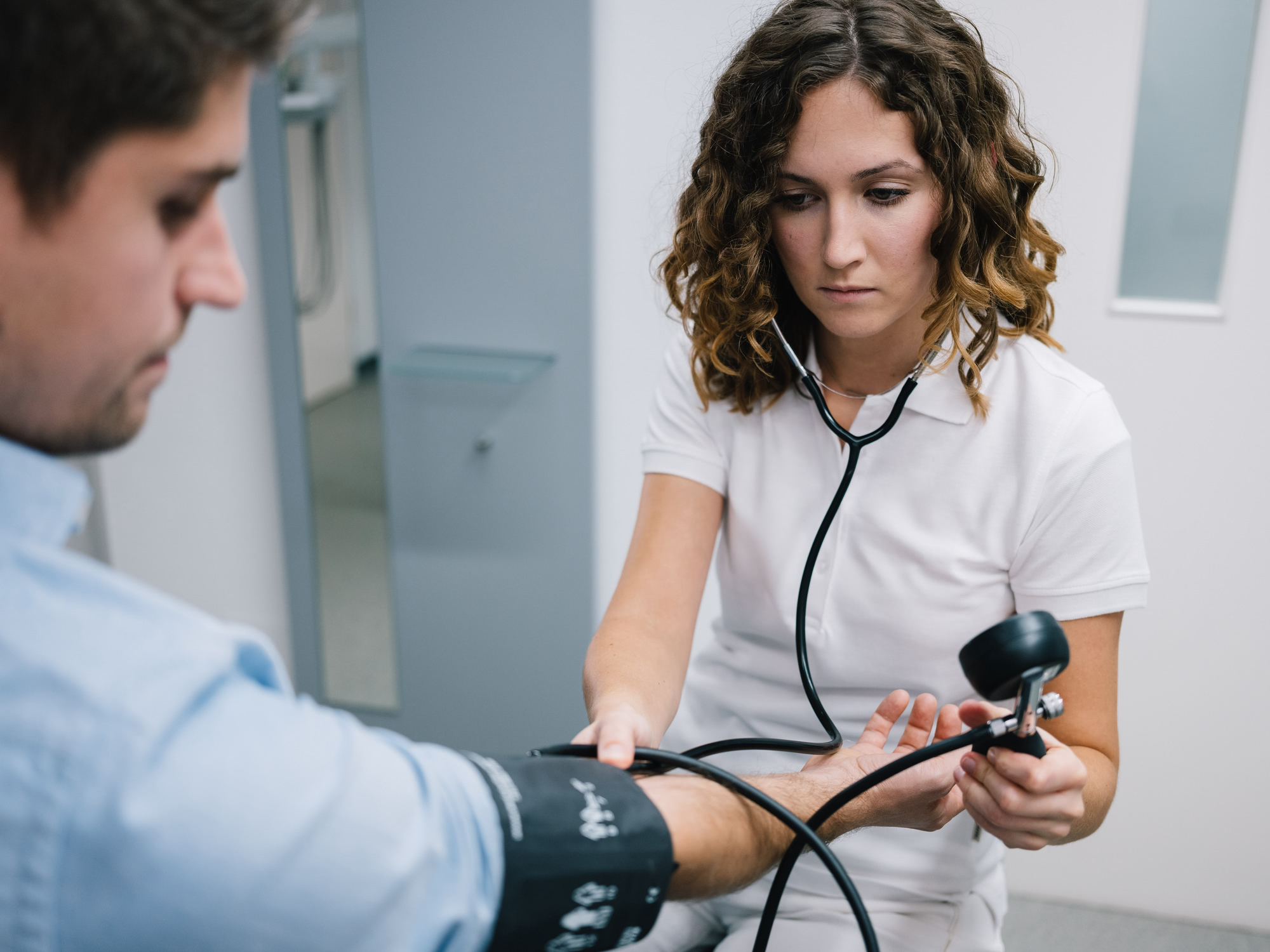 Medical Assistant taking Vitals on a Patient