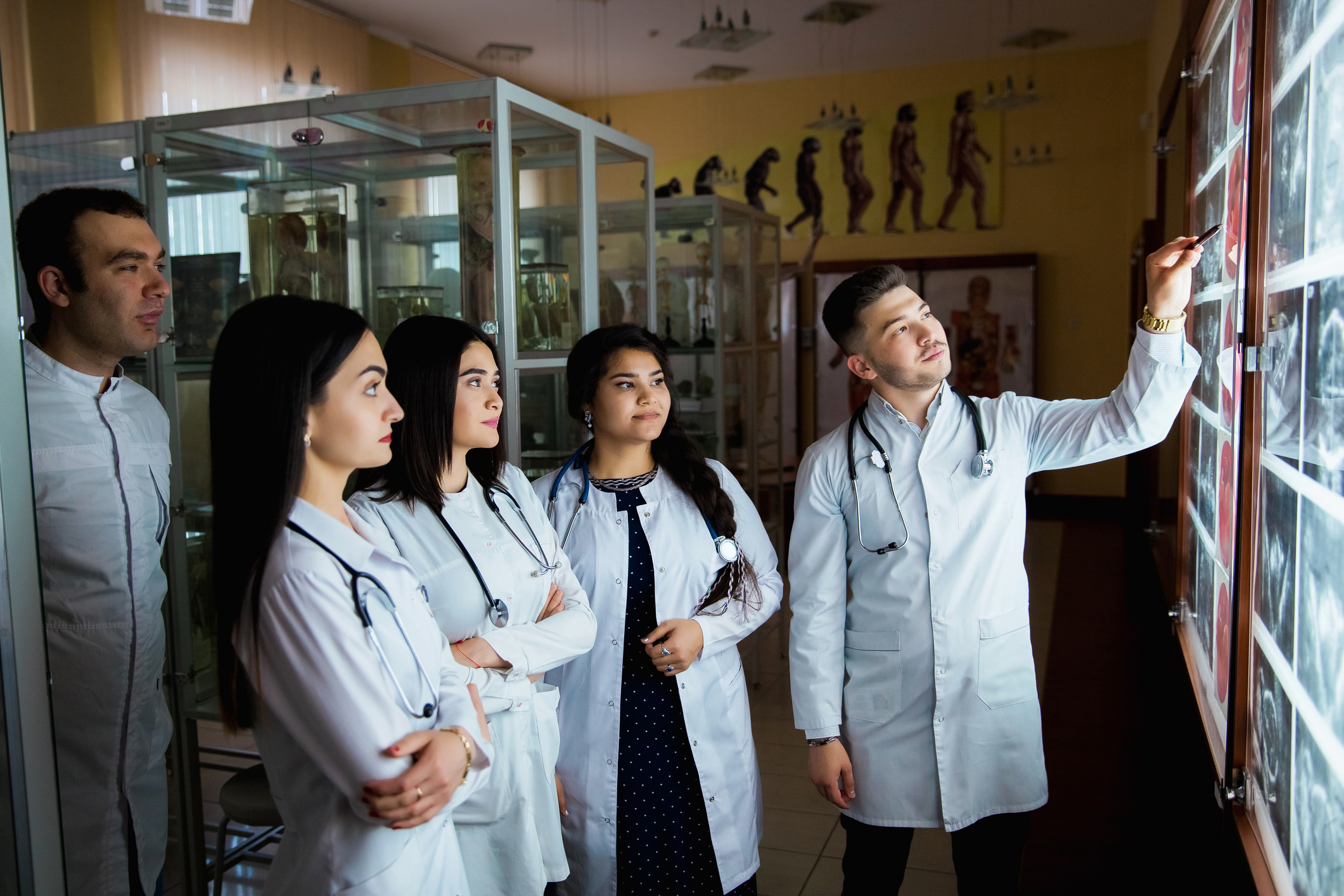 Medical Assistant showing xrays to students